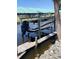 Covered boat lift with wooden deck on the canal provides easy water access for boating and recreation at 824 E 6Th St, Englewood, FL 34223