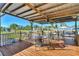 Relaxing covered patio with table and chairs, overlooking the canal at 824 E 6Th St, Englewood, FL 34223