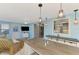 Casual dining area with view into kitchen and access to sunroom at 824 E 6Th St, Englewood, FL 34223