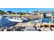 Private dock with boat lift and steps leading to the water at 824 E 6Th St, Englewood, FL 34223