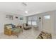 Bright and airy living room with comfy seating and access to kitchen at 824 E 6Th St, Englewood, FL 34223