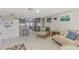 Open living space with a view into updated kitchen at 824 E 6Th St, Englewood, FL 34223
