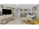 Cozy living room featuring a comfy seating area and built-in entertainment center at 824 E 6Th St, Englewood, FL 34223