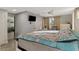 Main bedroom with king bed and access to bathroom and sitting area at 824 E 6Th St, Englewood, FL 34223