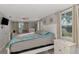 Spacious main bedroom with large bed and ensuite bathroom at 824 E 6Th St, Englewood, FL 34223