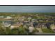 Overview of waterfront homes and landscaping at 10550 Alpaca Cir, Port Charlotte, FL 33981