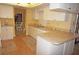 Galley style kitchen with light colored cabinets at 13523 Drysdale Ave, Port Charlotte, FL 33981