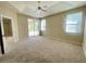 Main bedroom with sliding glass doors leading to the patio at 1436 Hedgewood Cir, North Port, FL 34288