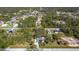 Aerial view of a single-Gathering home with a pool, situated on a large lot at 14454 Nw Chamberlain Blvd, Port Charlotte, FL 33953