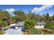 Aerial view of a single-story home with carport and large yard at 14454 Nw Chamberlain Blvd, Port Charlotte, FL 33953