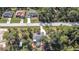 Aerial view of a house with a pool, surrounded by trees at 14454 Nw Chamberlain Blvd, Port Charlotte, FL 33953