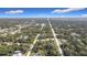 Aerial view of property, showcasing neighborhood and surrounding landscape at 14454 Nw Chamberlain Blvd, Port Charlotte, FL 33953