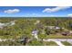 Aerial view of the property showing the house and surrounding neighborhood at 14454 Nw Chamberlain Blvd, Port Charlotte, FL 33953