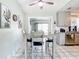 Kitchen dining area with grey table and four chairs at 14454 Nw Chamberlain Blvd, Port Charlotte, FL 33953
