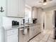 Modern kitchen with granite countertops and stainless steel appliances at 14454 Nw Chamberlain Blvd, Port Charlotte, FL 33953