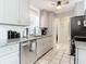 Modern kitchen with granite countertops and stainless steel appliances at 14454 Nw Chamberlain Blvd, Port Charlotte, FL 33953