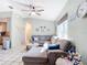Spacious living room featuring a large sectional sofa and coastal decor at 14454 Nw Chamberlain Blvd, Port Charlotte, FL 33953