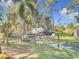 Landscaped side yard with shed and a partially visible vehicle at 14454 Nw Chamberlain Blvd, Port Charlotte, FL 33953