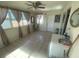 Bright Florida room with tile floors and window coverings at 175 Francis Ne Dr, Port Charlotte, FL 33952