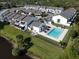 Aerial view of community with pool, showing building exteriors and landscaping at 2000 Forrest Nelson Blvd # C8, Port Charlotte, FL 33952