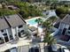 Aerial view showcasing townhomes, pool and canal views at 2000 Forrest Nelson Blvd # C8, Port Charlotte, FL 33952