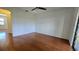 Bright bedroom with hardwood floors and ceiling fan at 2000 Forrest Nelson Blvd # C8, Port Charlotte, FL 33952