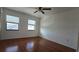 Spacious bedroom with hardwood floors and two windows at 2000 Forrest Nelson Blvd # C8, Port Charlotte, FL 33952