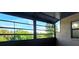 Enclosed balcony offering tranquil views of nature at 2000 Forrest Nelson Blvd # C8, Port Charlotte, FL 33952
