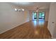 Bright living room with laminate floors and access to a screened patio at 2000 Forrest Nelson Blvd # C8, Port Charlotte, FL 33952