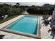 Community pool with patio area and canal views at 2000 Forrest Nelson Blvd # C8, Port Charlotte, FL 33952