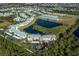 Aerial view of condo building near lake at 2160 Heron Lake Dr # 104, Port Charlotte, FL 33983