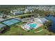 Community overview featuring pool, tennis courts, and clubhouse at 2160 Heron Lake Dr # 104, Port Charlotte, FL 33983