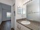 Bathroom boasts a single sink vanity and a shower stall at 2160 Heron Lake Dr # 104, Port Charlotte, FL 33983
