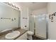 Bathroom with a toilet and a glass-enclosed shower at 2160 Heron Lake Dr # 104, Port Charlotte, FL 33983