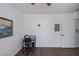 Bedroom with wood floors and a workspace at 2160 Heron Lake Dr # 104, Port Charlotte, FL 33983