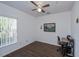 Bright bedroom with wood floors and built-in workspace at 2160 Heron Lake Dr # 104, Port Charlotte, FL 33983