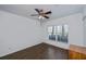 Spacious bedroom with wood-look floors and large window at 2160 Heron Lake Dr # 104, Port Charlotte, FL 33983
