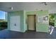 Building entrance with elevator and storage at 2160 Heron Lake Dr # 104, Port Charlotte, FL 33983