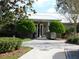 Community clubhouse entrance with landscaping at 2160 Heron Lake Dr # 104, Port Charlotte, FL 33983