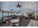 Spacious clubhouse with tables, chairs, and fireplace at 2160 Heron Lake Dr # 104, Port Charlotte, FL 33983