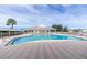 Relaxing pool area with plenty of lounge chairs and shade at 2160 Heron Lake Dr # 104, Port Charlotte, FL 33983