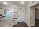 Bright entryway with wood-look floors and access to kitchen and living areas at 2160 Heron Lake Dr # 104, Port Charlotte, FL 33983