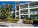 Condo building entrance with landscaping at 2160 Heron Lake Dr # 104, Port Charlotte, FL 33983