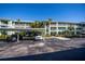 Community building exterior with parking at 2160 Heron Lake Dr # 104, Port Charlotte, FL 33983