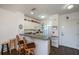 Condo kitchen with breakfast bar and white cabinets at 2160 Heron Lake Dr # 104, Port Charlotte, FL 33983