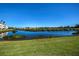 View of lake and lush green landscape at 2160 Heron Lake Dr # 104, Port Charlotte, FL 33983