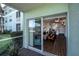 Screened-in porch with view of condo building and pond at 2160 Heron Lake Dr # 104, Port Charlotte, FL 33983