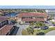 Aerial view of condo building with water access and parking at 240 Lewis Cir # 29, Punta Gorda, FL 33950