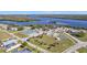 Aerial view of neighborhood with tennis and basketball courts at 27409 Voyageur Dr, Punta Gorda, FL 33983