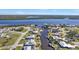 Aerial view of waterfront homes with private docks and lush landscaping at 27409 Voyageur Dr, Punta Gorda, FL 33983